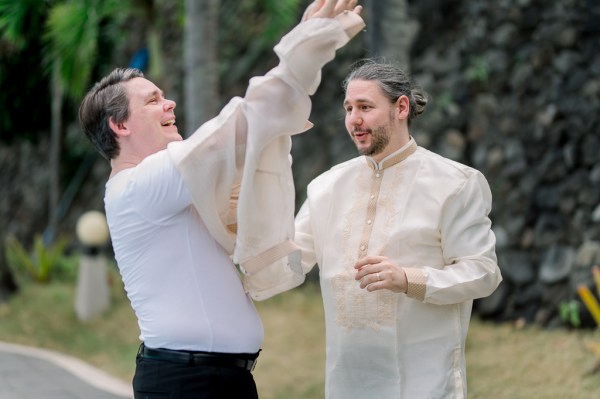 groom and groomsmen getting ready together