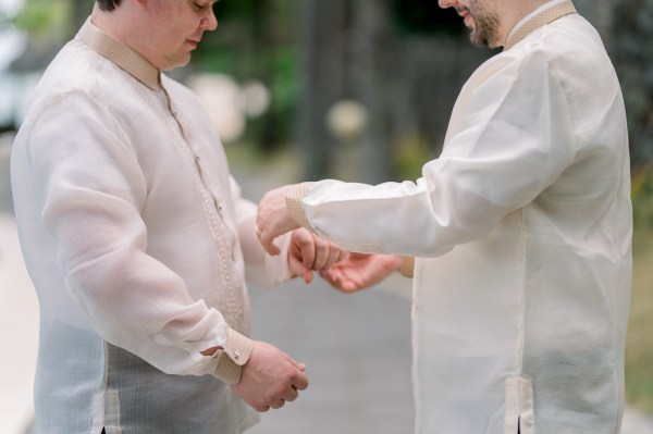 groom and groomsmen getting ready together