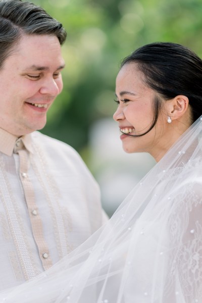 bride laughs with groom