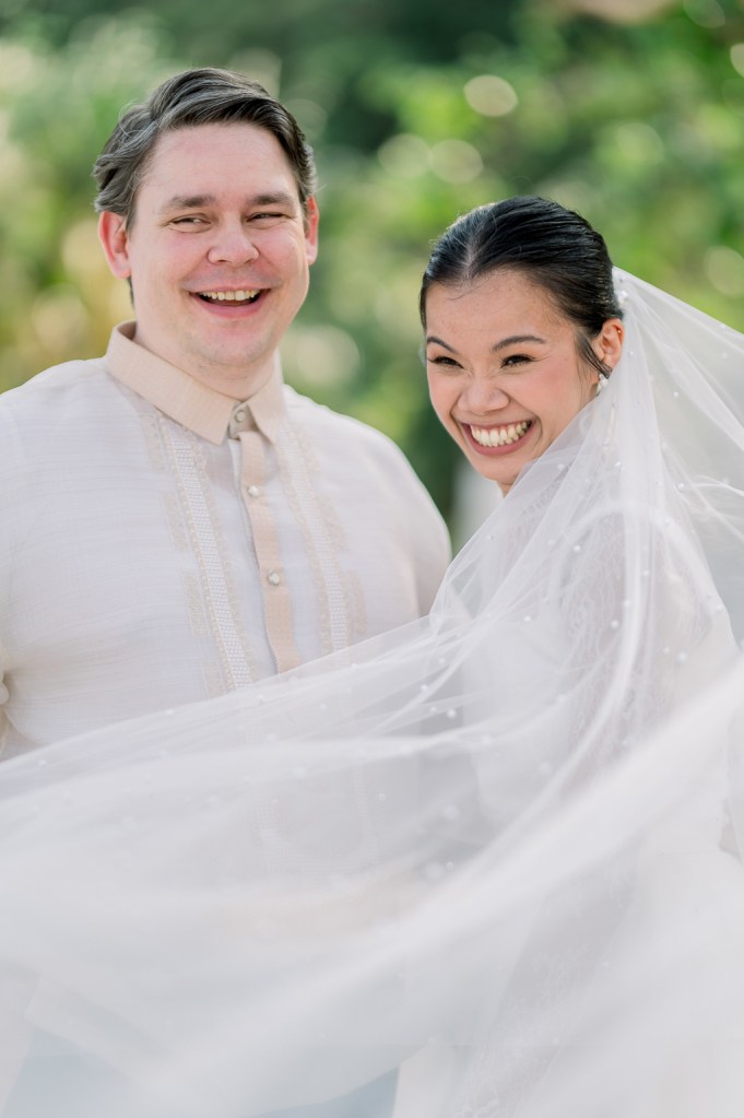 bride laughs with groom