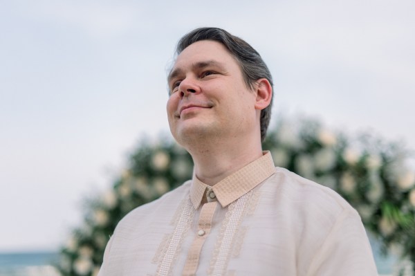 emotional groom awaits his bride