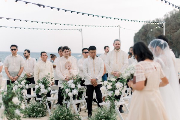 groomsmen standing during ceremony