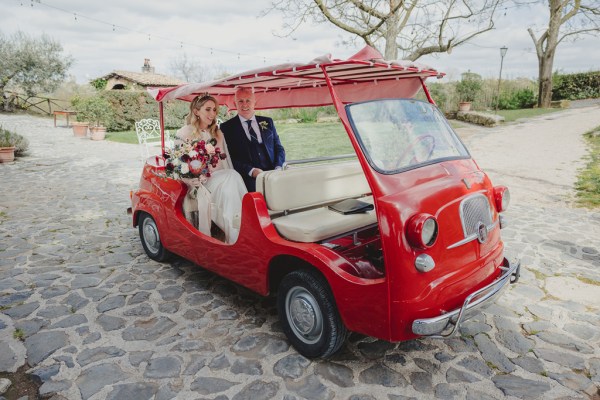 father of the bride walks his daughter towards wedding car and gets in