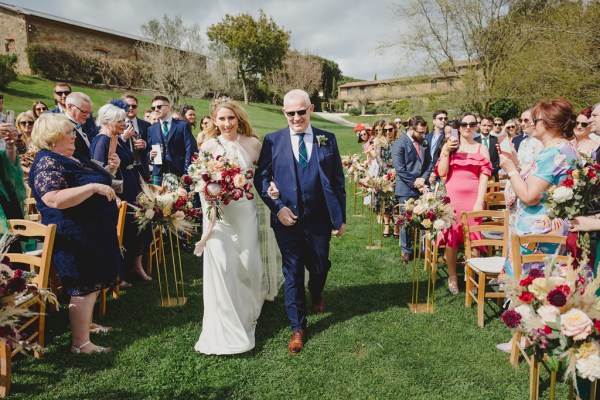 father of the bride walks his daughter down the aisle