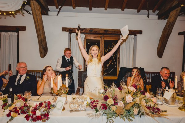 dining room table guests bride and groom celebrating at the table