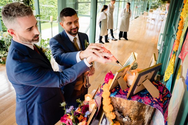 grooms at table setup photo frames