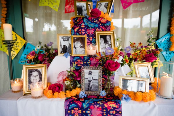 colourful table setup orange photo frames patterned table cloth