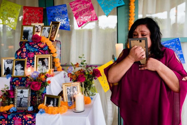 woman takes a look at photo in frame he gets emotional