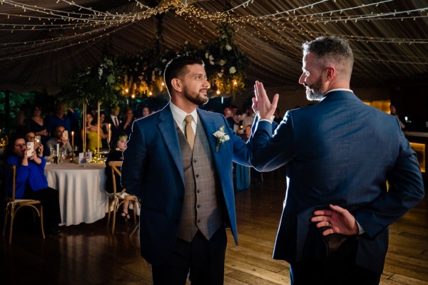 grooms dance on the dancefloor together