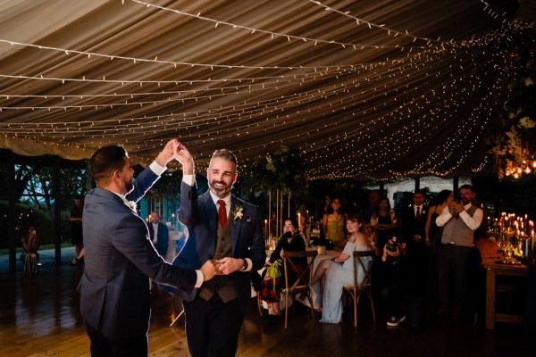 grooms dance on the dancefloor together