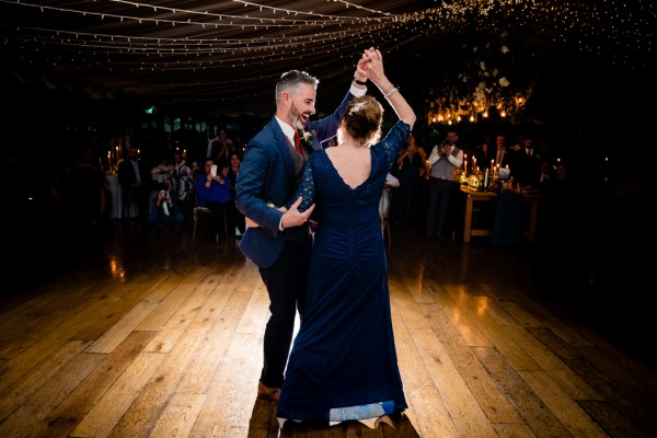 groom dances with mother on the dancefloor