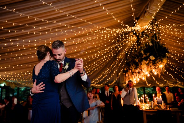 groom dances with mother on the dancefloor