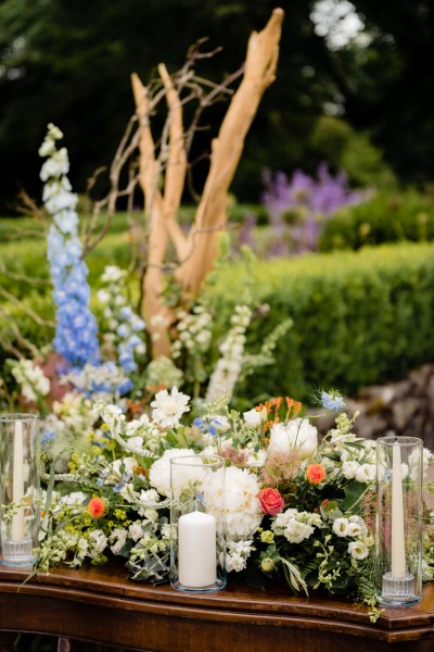 alter table wooden covered in flowers and candles