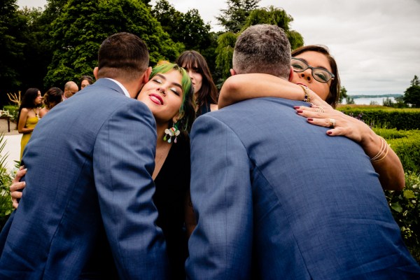 grooms and women hug