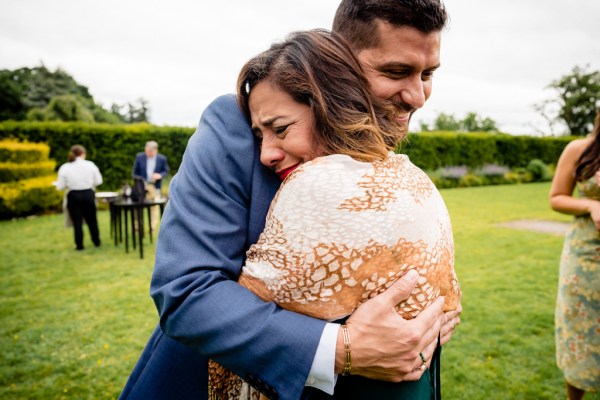 emotional woman hugs the groom