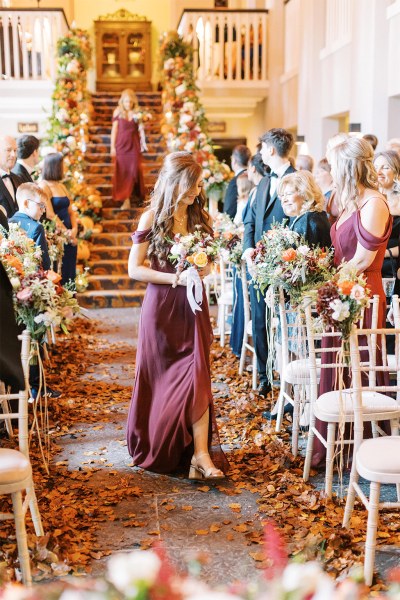 Bridesmaid walks down the aisle