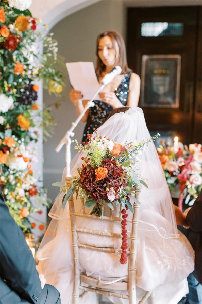 Celebrant reads speech into microphone