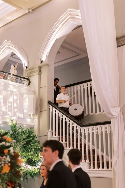 Musician band play music drums as they walk down the stairs