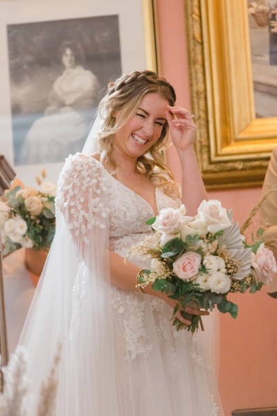 emotional bride laughs/smiles