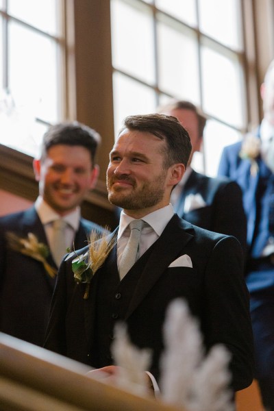 smiling groom and groomsmen