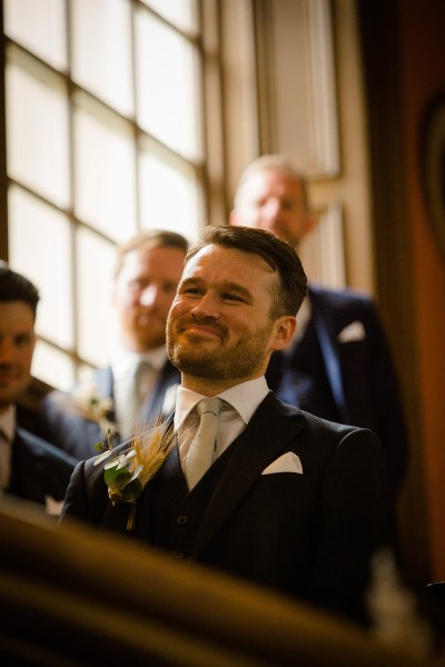 smiling groom and groomsmen