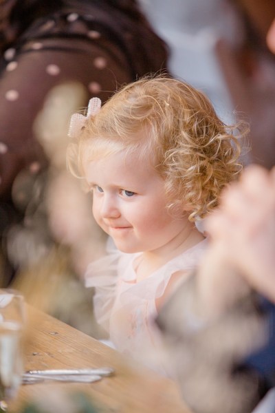 little blonde girl at table