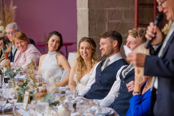 bride and groom smiling