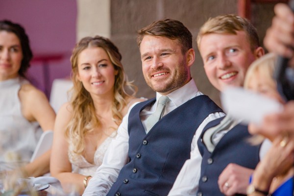 bride and groom smiling