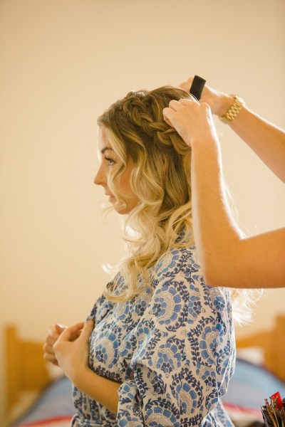 bride getting ready for wedding blonde wavy hair