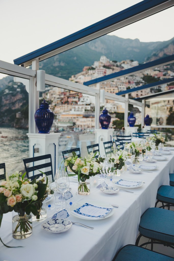 Tables with white table setting and pink and white flowers