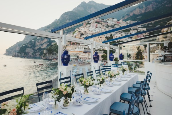 Tables with white table setting and pink and white flowers