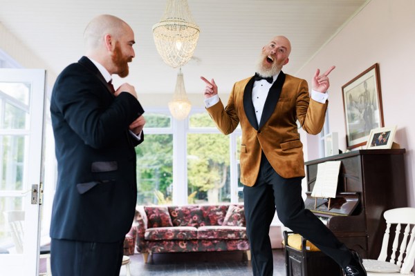 groom and groomsman joking around playfully