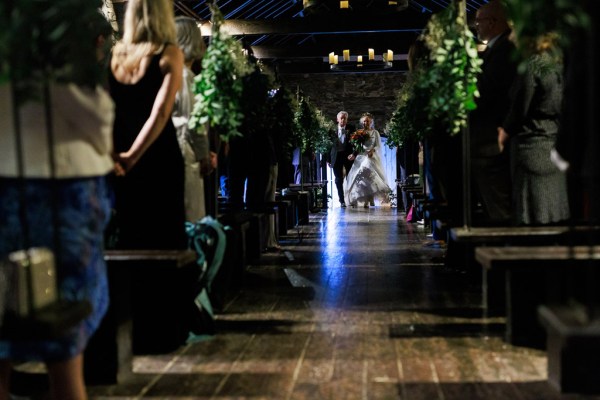 father of the bride walks his daughter down the aisle