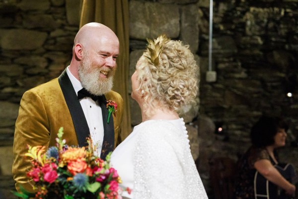 groom and bride greet each other at the alter