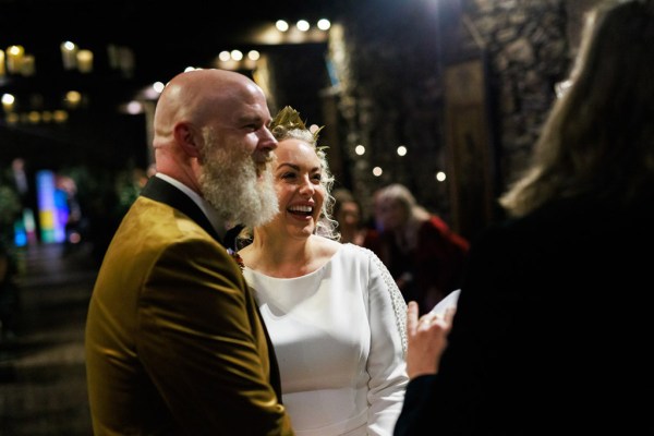 bride groom and celebrant smile