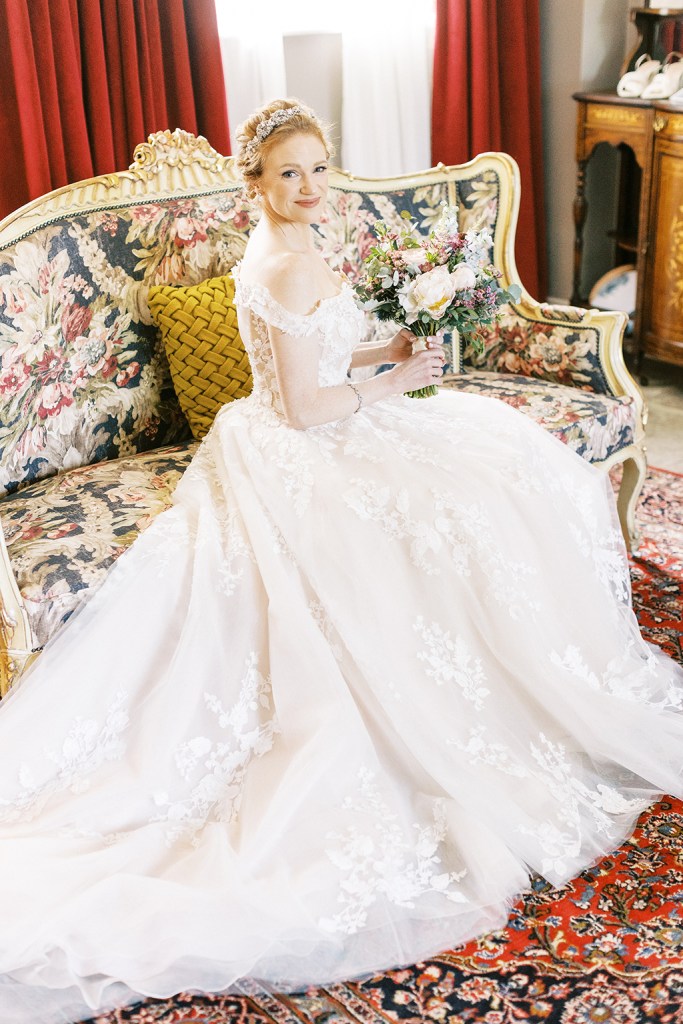 bride seated on elegant Victorian sofa chair