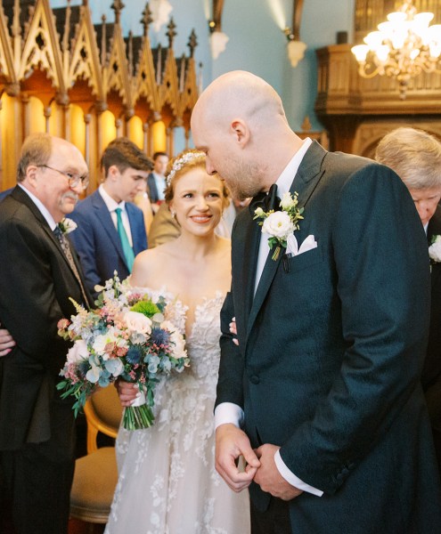 bride and groom smile interior church setting