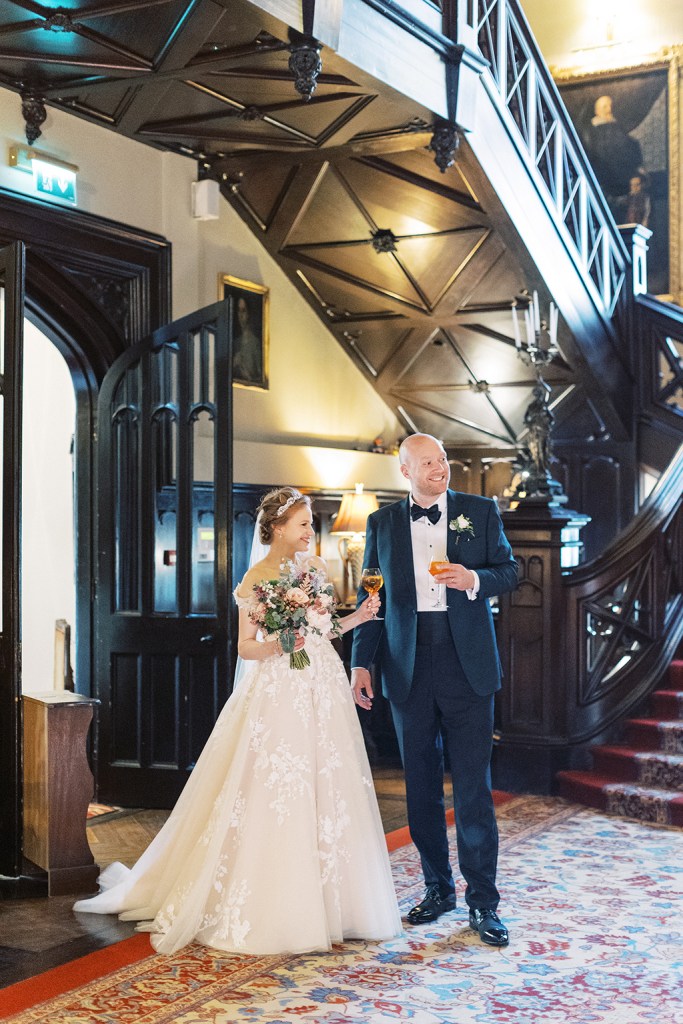 bride and groom enter wedding venue setting