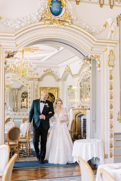 bride and groom walk in dining room setting interior