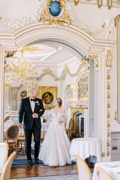 bride and groom walk in dining room setting interior