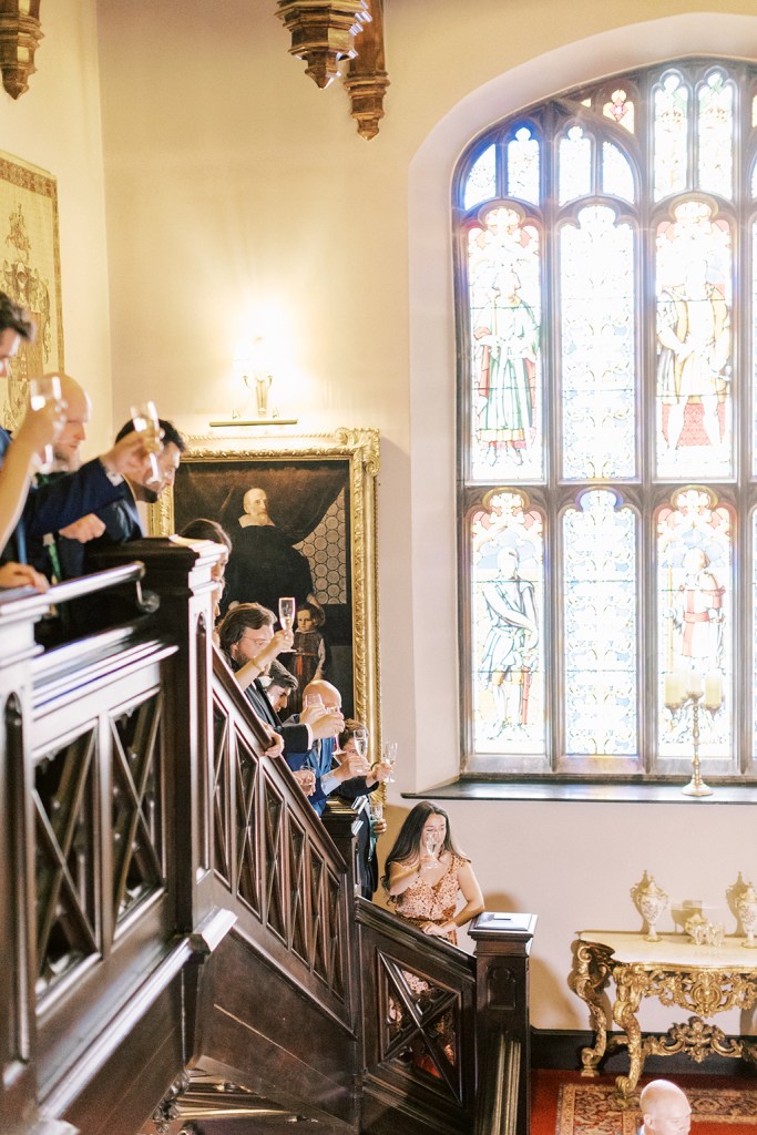 guests look down at ceremony setting large tinted windows