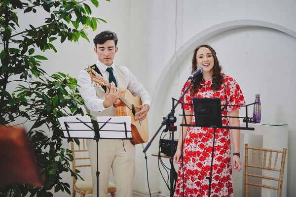 Wedding band guitarist and singer singing