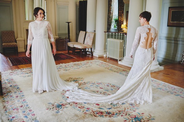 Two bride smiling at each other