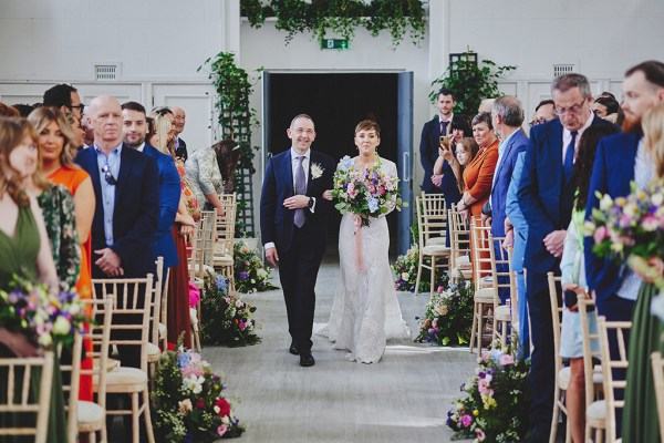 Father of the bride walks daughter down the aisle