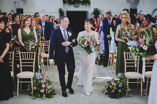 Father of the bride walks daughter down the aisle