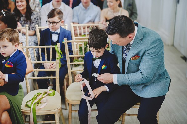 Man with little boy both seated