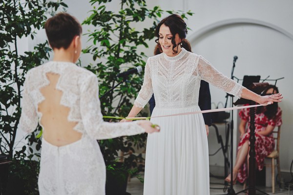 Brides hold out ribbon