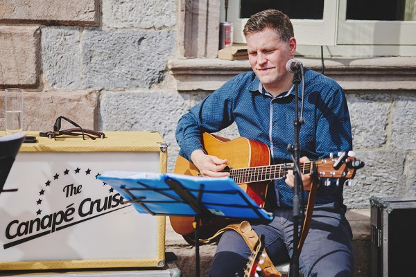 Wedding musician plays guitar and sings