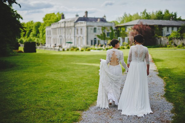 Brides walk from behind towards wedding venue