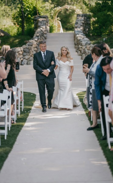 Father of the bride walks his daughter down the aisle